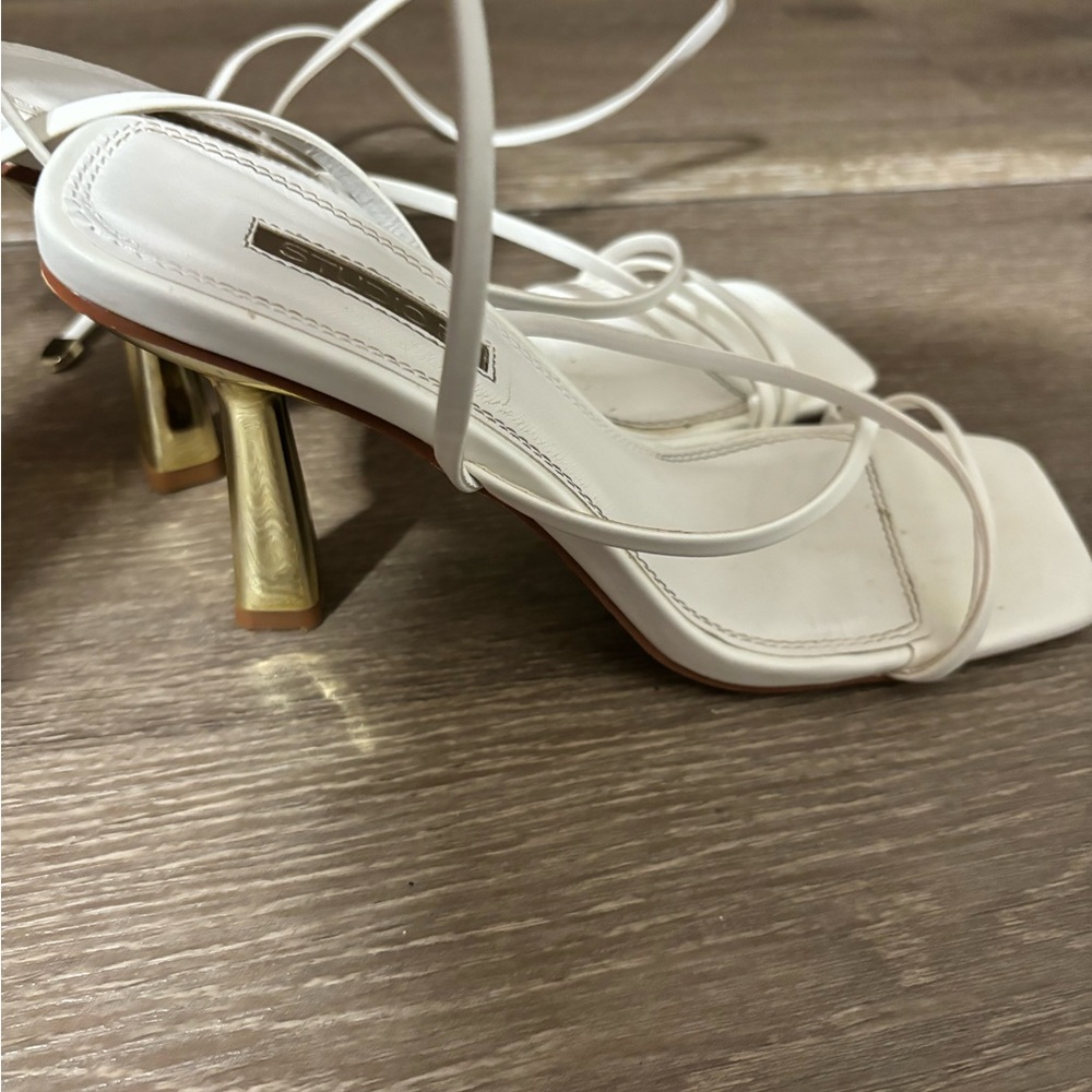 White strap heels with gold heel